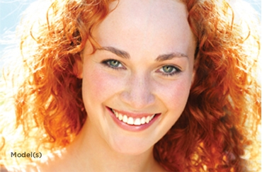 model with red curly hair